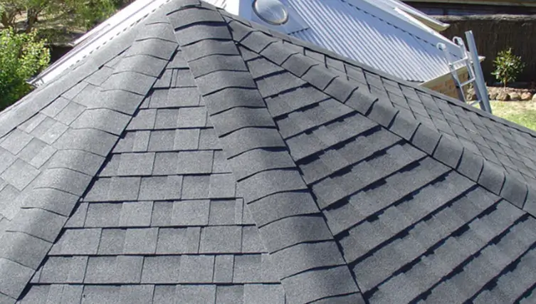 Close-up of a dark gray asphalt shingle roof on a gazebo, showing texture and pattern.